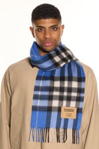 A stack of folded plaid cashmere scarves in different colours.