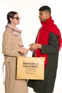 Customer asking Edinburgh Cashmere staff about fibre specification